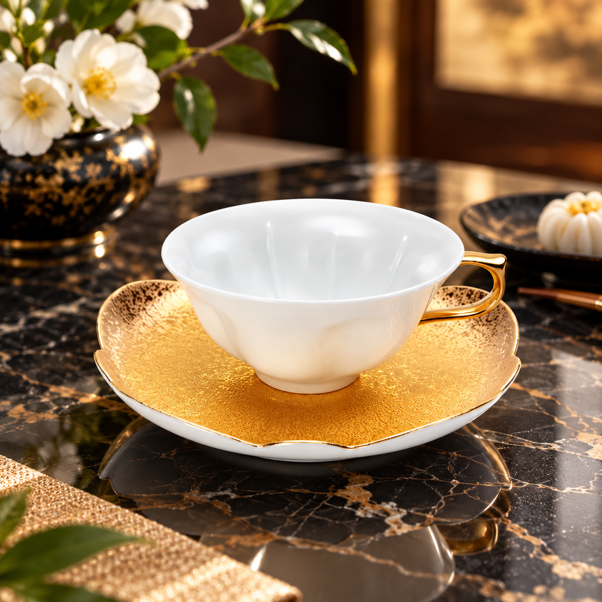 ARITA WARE JAPANESE WHITE PORCELAIN SAKURA TEACUP WITH GOLD LEAF AND RAISED FOOT/ TASEI KILN