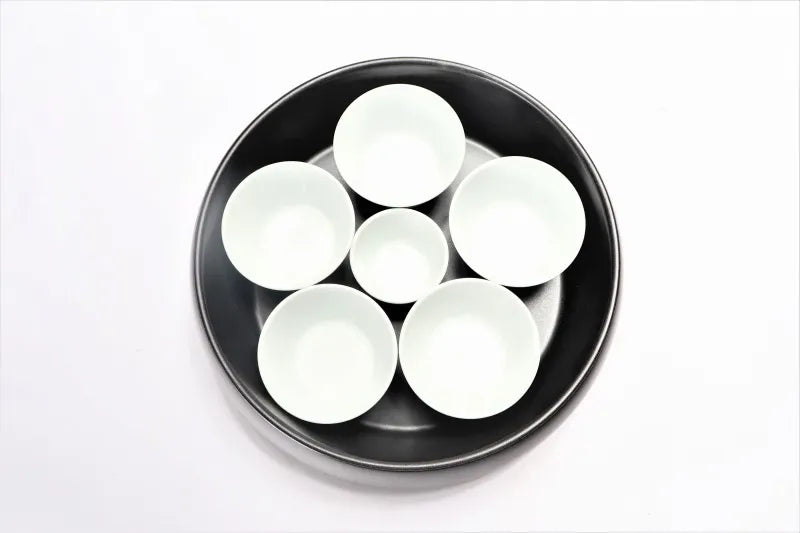 ARITA JAPANESE PORCELAIN BLACK GLAZE FOUR-TIER JEWEL-SHAPED JUBAKO BENTO BOX – RISOGAMA KILN