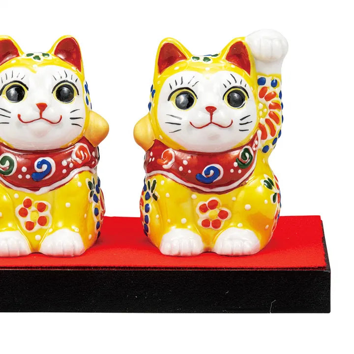 KUTANI WARE PAIR MANEKI NEKO – LUCKY CAT FIGURINES WITH YELLOW EMBELLISHMENT, DISPLAY STAND, CLOTH, AND NAMEPLATE