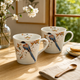 KUTANI WARE PORCELAIN PAIR MUGS – MOUNTAIN CHERRY BLOSSOMS AND BIRD MOTIF