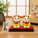 KUTANI WARE PAIR MANEKI NEKO – LUCKY CAT FIGURINES WITH YELLOW EMBELLISHMENT, DISPLAY STAND, CLOTH, AND NAMEPLATE