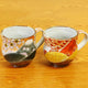 KUTANI WARE PAIR OF MUGS – HANDCRAFTED JAPANESE PORCELAIN ‘SPRING FUJI & AUTUMN FUJI’ BY YOSHINORI FUKUDA